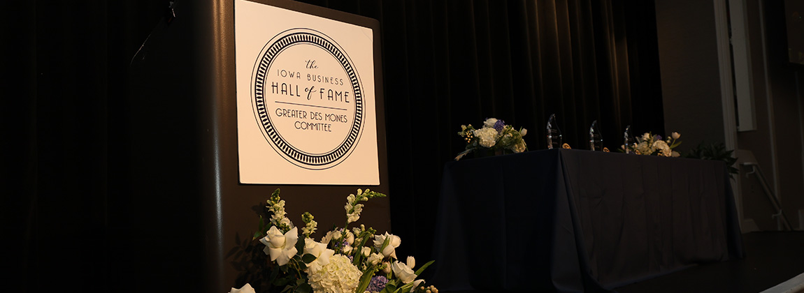 A podium with a poster that says 